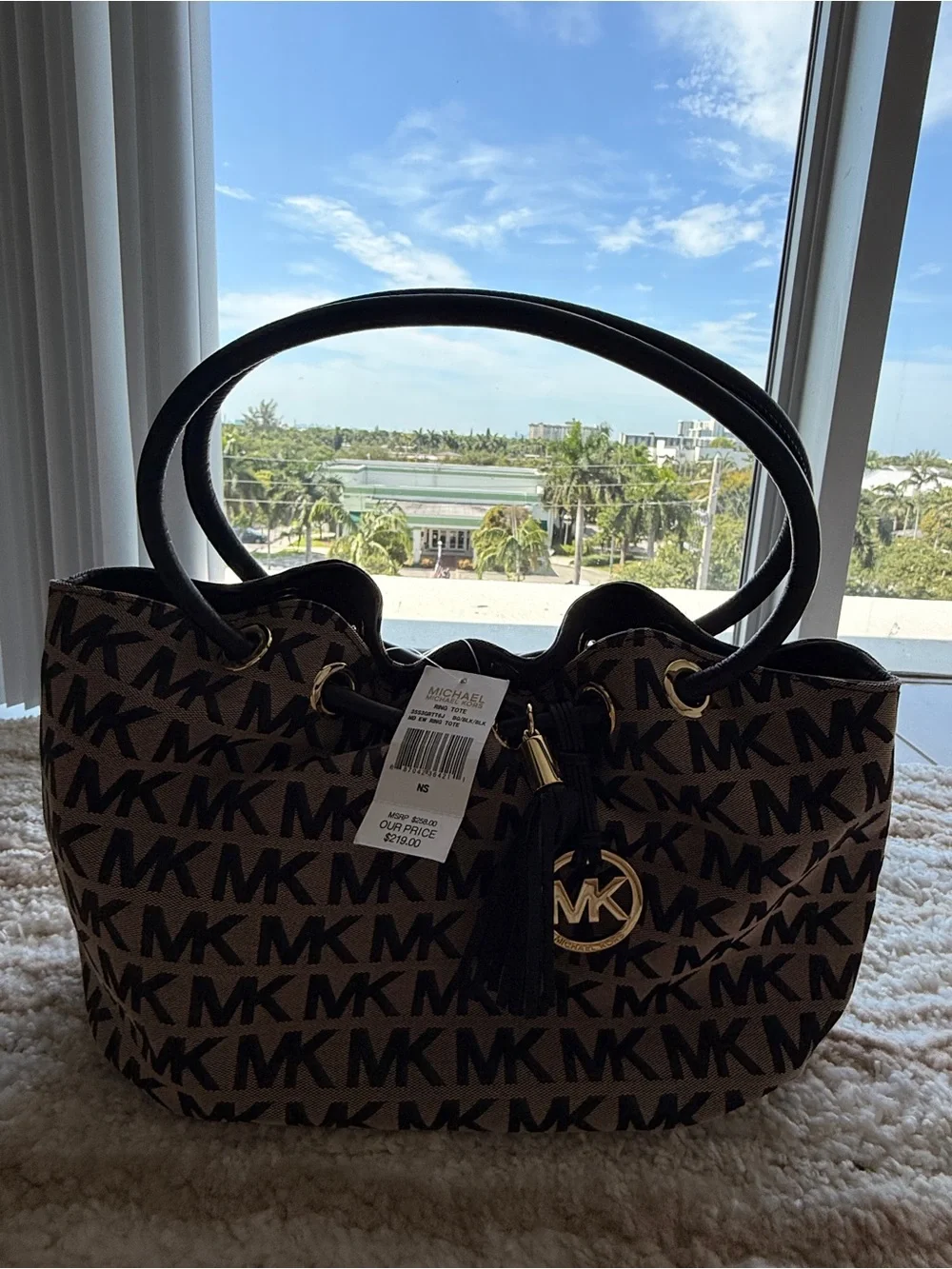 Michael Kors Brown and Black MK Signature Tote with Tassel Charm